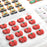 Artisanal dark chocolate bark pieces topped with colorful edible sugar decorations for holiday gifts.