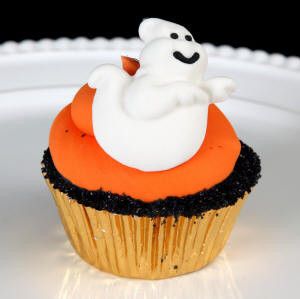 Cheerful Edible Fondant Ghosts cupcake toppers perfect for halloween cakes and cupcakes.