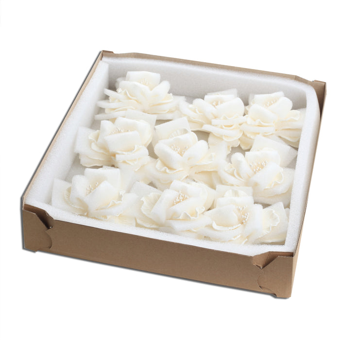 Premade large white Cora peony sugar flower placed on a modern rustic buttercream cake by Caljava