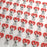 Assorted back-to-school royal icing toppers decorating artisan chocolate truffles to streamline confectionery output during peak back-to-school order rushes by Caljava