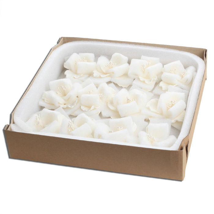 Premade white Cora peony sugar flower placed on a modern rustic buttercream cake.