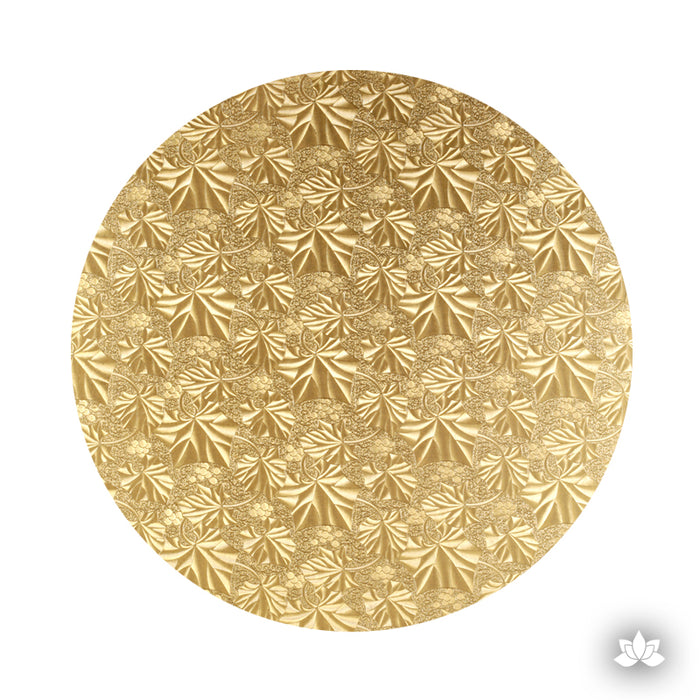 Cake Drum Gold Foil, great for displaying your decorated cake while providing a sturdy base for transporting your cake. Embossed gold foil cake drum base supporting a tiered celebration cake