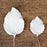Close-up showing two sizes of green gum paste rose leaves with dimensions 2.5x1.75 inches and 1.5x1.25 inches with flexible wire stems.Wholesale cake supply.