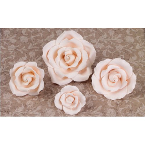 A 12-count box of wholesale ivory gumpaste English garden roses ideal for professional cake artists during wedding season.